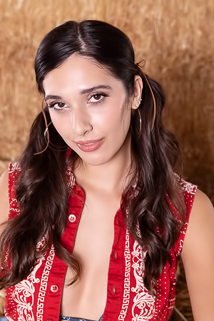 Aria Sloane American Brunette Swishes Her Long Pigtails With A Sassy Smile