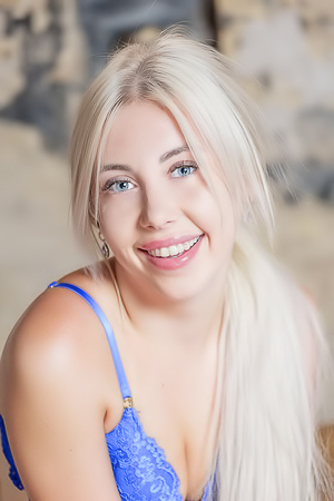 Nico Platinum Blonde Hair Cascades Over Her Shoulders