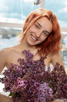 Emma A Smiles Naturally Posing Nude By The Kitchen Window
