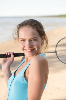 Faina Bona Enjoying A Game Of Beach Badminton