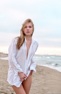 Luise Vivacious Blue-eyed Babe Stretches Out In The Warm Sand