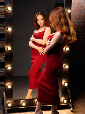 Rinna Ly Sultry Redhead Watches Herself In The Mirror