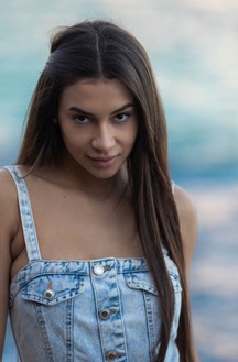 Vanessa Alessia Teases In A Denim Dress On A Beach Towel Under Golden Light