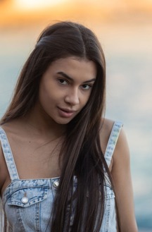 Vanessa Alessia Teases In A Denim Dress On A Beach Towel Under Golden Light