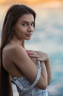 Vanessa Alessia Teases In A Denim Dress On A Beach Towel Under Golden Light
