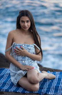 Vanessa Alessia Teases In A Denim Dress On A Beach Towel Under Golden Light