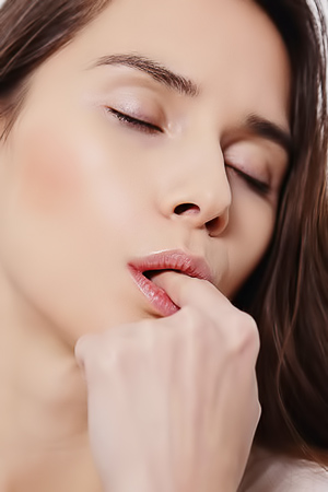 Leona A Strokes Her Shaved Pussy