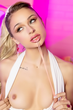 Tavia teases with a sultry striptease, showcasing her toned physique