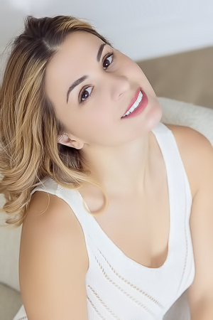 Alice Kelly Dark-eyed Siren Smiles Enticingly As The Straps Slide From Her Shoulders