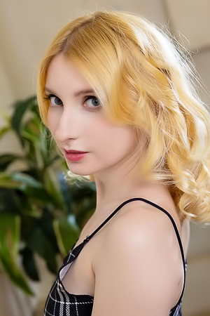 Minnie Lighter Squeezing Her Gorgeous Breasts And Smiles Seductively