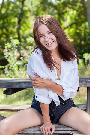 Skye Bloom Perching On A Picnic Table In The Park