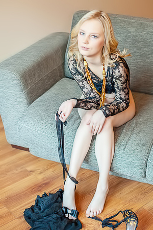 Lynne Dominates In A Tantalizing Sheer Striptease On A Couch Indoors
