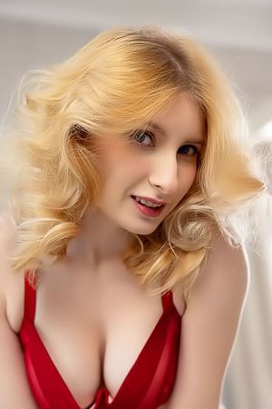 Minnie Lighter Teases On The Couch With Seductive Lingerie And Alluring Curves