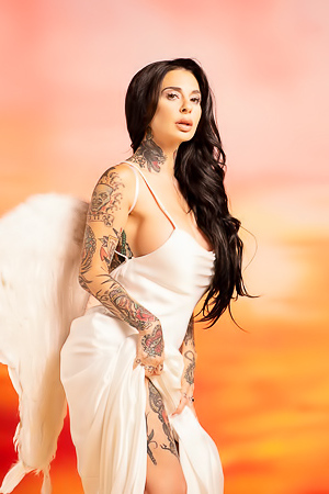 Joanna Angel Poses Nude With Angel Wings And Tattoos Against A Sunset Backdrop In Solo Photos